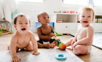 three babies playing at daycare