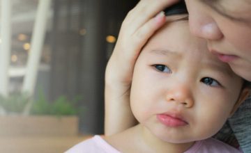 Mother helping toddler cope with grief and death