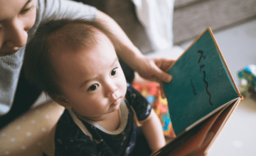 showing a boy a book